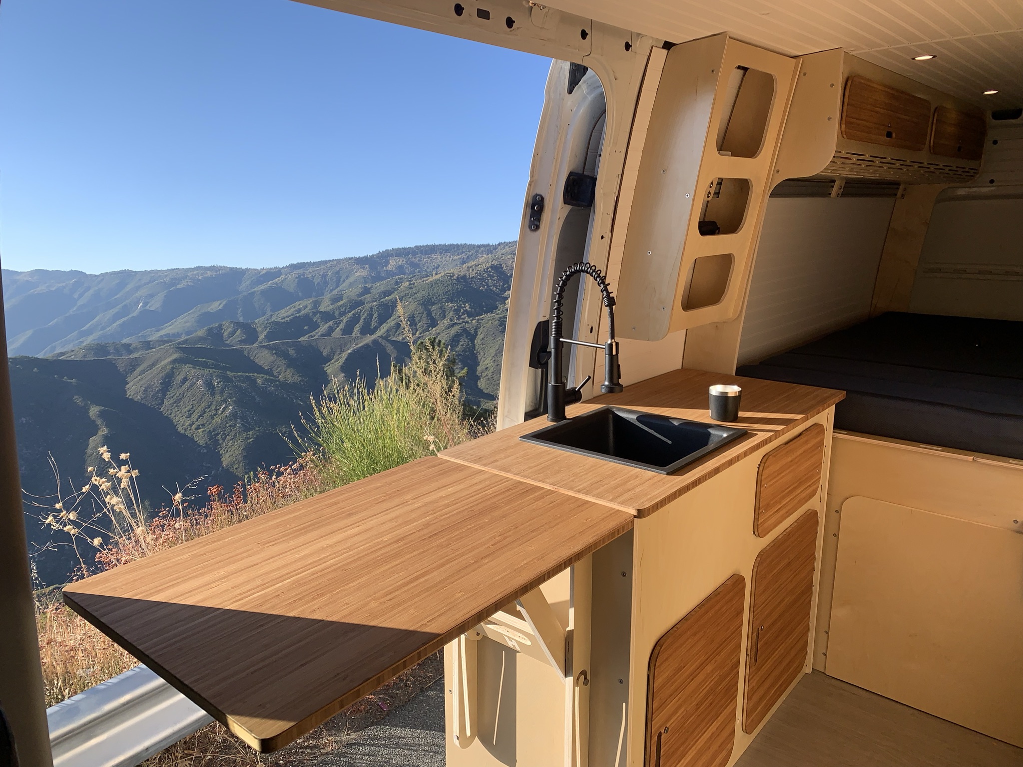 Vantopia Van Baltic birch and bamboo galley and dinette interior